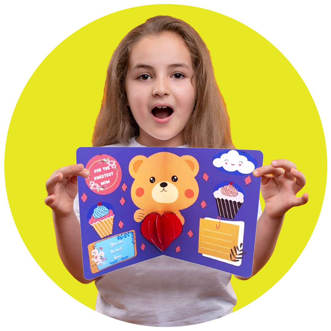 Girl holding SparkLPlay pop-up greeting card kit