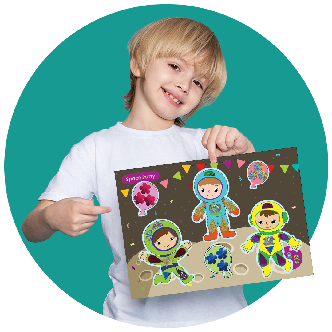 Boy holding SparkLPlay Space Party foil art kit